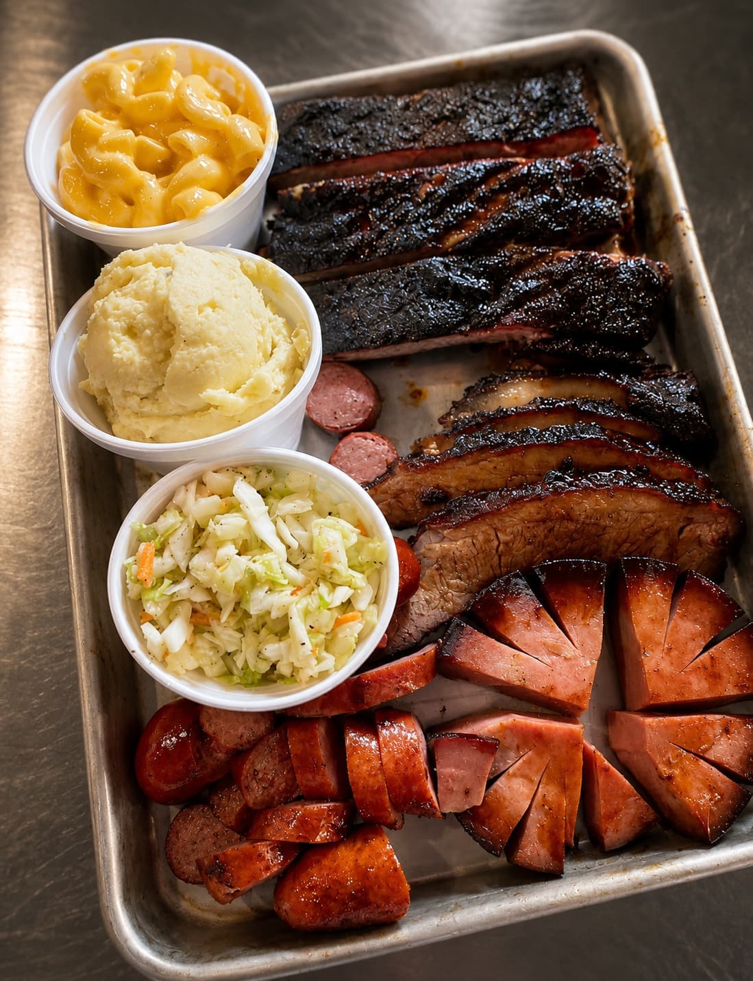 Three-meat barbecue tray with sides at Sammies Bar-B-Q in Fort Worth, TX